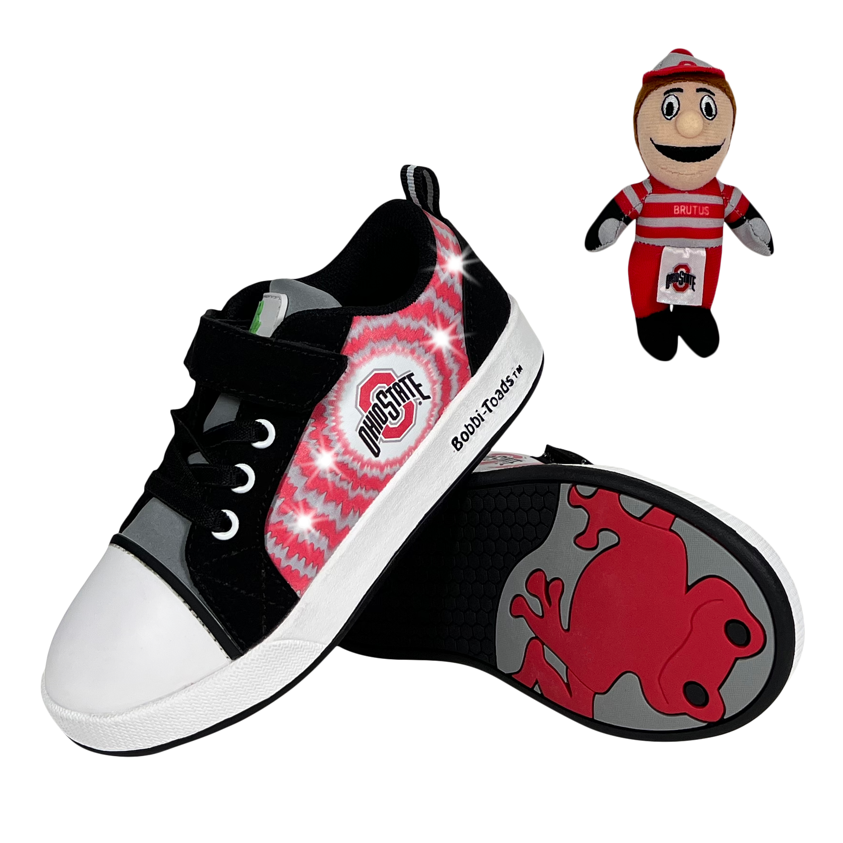 Black sneakers with red and gray design, Ohio State logo, and a small plush toy on a white background